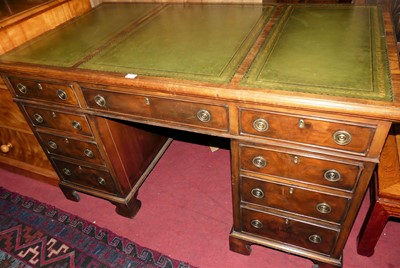 Lot 1444 - A mahogany and gilt tooled green leather inset...