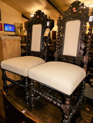 Lot 1455 - A pair of circa 1900 heavily floral carved oak...