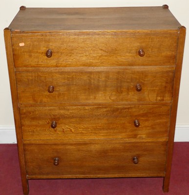 Lot 1449 - An Arts & Crafts oak chest of four long...