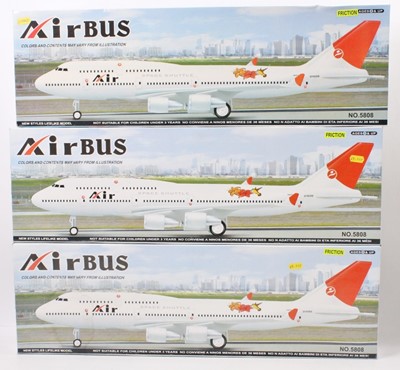 Lot 808 - 3 boxed friction powered Air Bus plastic...