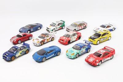 Lot 855 - 12 various unboxed Scalextric slot cars to...
