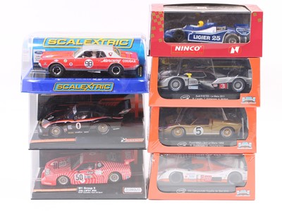Lot 861 - A collection of boxed 1/32nd scale slot cars...