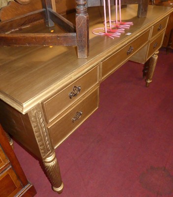 Lot 1274 - A gilt painted hardwood kneehole writing table,...