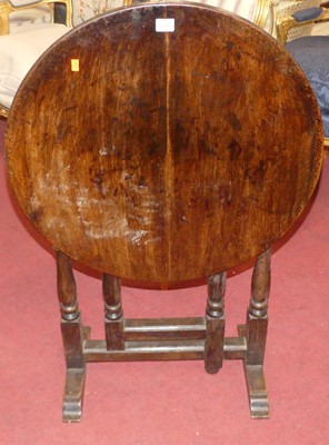 Lot 1348 - A joined oak circular tilt-top gateleg...