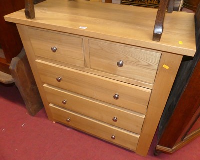 Lot 1375 - A contemporary blond oak square front chest of...