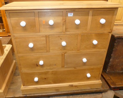 Lot 1380 - A modern pine low fitted side chest, with an...