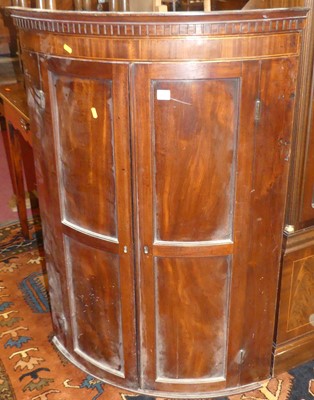 Lot 1385 - An early 19th century mahogany bow front...