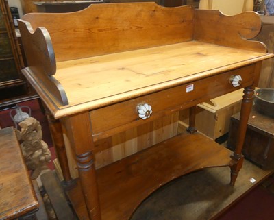 Lot 1390 - A Victorian stained pine three-quarter gallery...