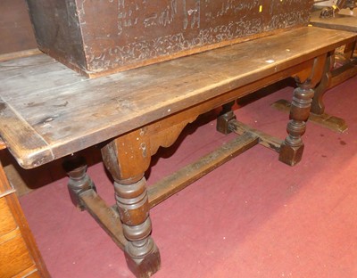 Lot 1393 - An antique joined oak plank top refectory...