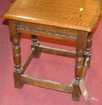 Lot 1395 - An oak joint stool, raised on turned and...