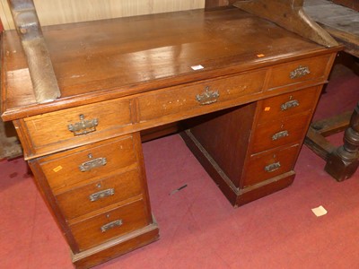 Lot 1397 - An Edwardian walnut twin pedestal writing desk,...