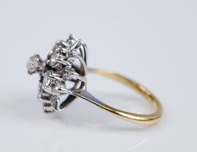 Lot 2679 - A yellow and white metal diamond flower shaped...