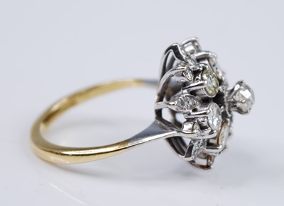 Lot 2679 - A yellow and white metal diamond flower shaped...