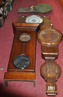 Lot 2039 - An oak aneroid wheel barometer; together with...