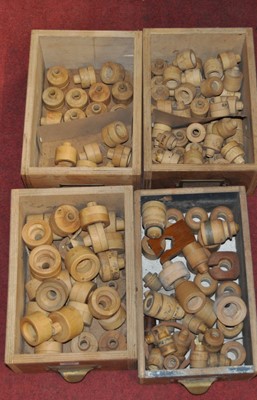 Lot 2059 - A collection of boxwood cisterns in varying...