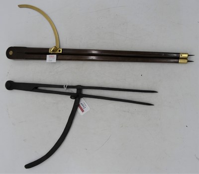 Lot 2169 - A pair of polished oak and brass tipped...