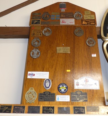 Lot 1023 - An oak noticeboard containing assorted...