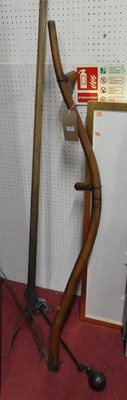 Lot 1157 - A scythe, a pitchfork, and an iron weighted...
