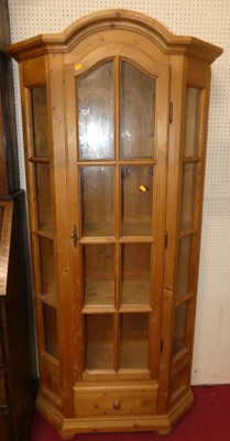 Lot 1160 - A modern pine single door glazed display...