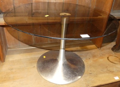 Lot 1282 - A 1970s smoky glass circular top low...