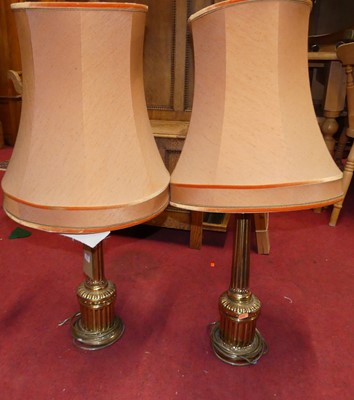Lot 1310 - A pair of fluted brass table lamps in the...