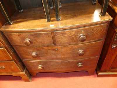 Lot 1312 - A 19th century elm bowfront low chest of two...