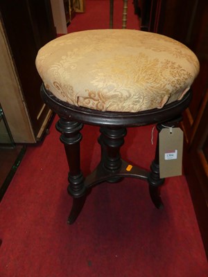 Lot 1304 - A Victorian mahogany circular music stool,...