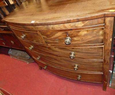 Lot 1305 - A George IV mahogany bowfront chest of two...