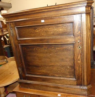 Lot 1362 - An oak low single door corner cupboard