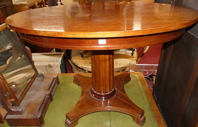 Lot 1373 - A mahogany oval pedestal centre table, raised...