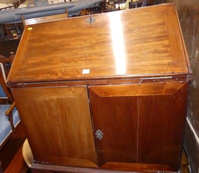 Lot 1382 - An early 19th century mahogany slopefront...