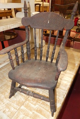 Lot 1394 - An early 20th century stained wood stick back...