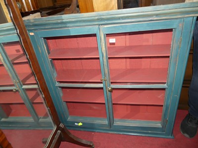 Lot 1399 - A painted pine two-door glazed hanging display...