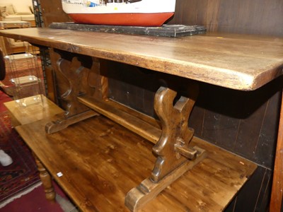 Lot 1417 - An oak trestle end dining table, length 182cm
