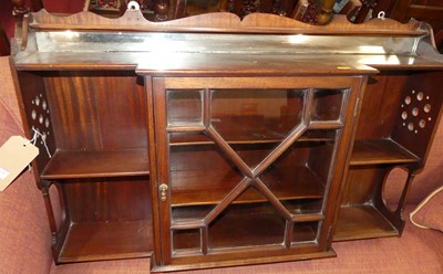 Lot 1426 - An Edwardian mahogany breakfront hanging wall...