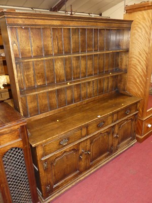 Lot 1421 - A joined oak Welsh dresser, having two-tier...