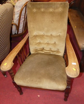 Lot 1440 - An Arts & Crafts oak open armchair, with...
