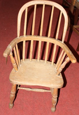 Lot 1444 - A 19th century child's elm stickback Windsor...