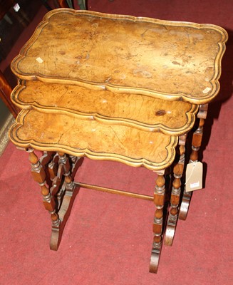 Lot 1460 - A figured walnut shaped nest of three...