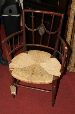 Lot 1464 - An Edwardian mahogany and rush seat spindle...