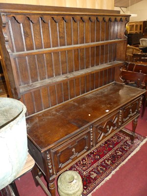 Lot 1483 - An early 20th century geometric moulded oak...