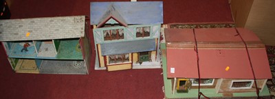 Lot 1672 - Three wooden and tinplate dolls houses