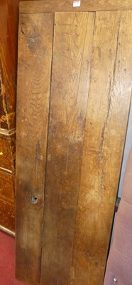 Lot 1159 - A rustic plank topped oak refectory table...