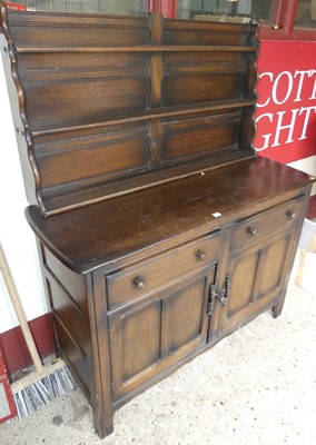 Lot 1171 - An Ercol dark elm dresser, w.130cm