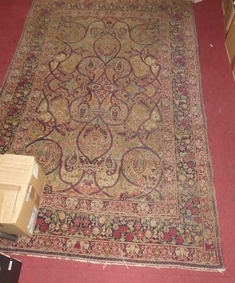 Lot 1176 - A Persian woollen red ground Tabriz rug,...