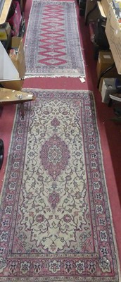 Lot 1180 - A Persian woollen red ground Bokhara hall...