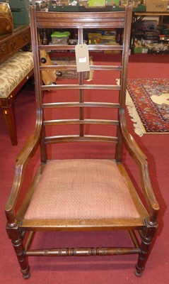 Lot 1207 - An Arts & Crafts walnut reeded ladderback...