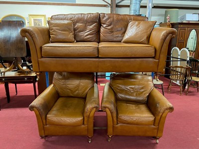Lot 1208 - A contemporary tan leather three-piece suite,...
