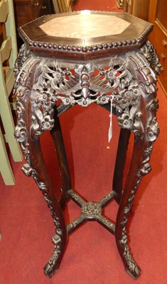 Lot 1213 - A Chinese carved rosewood jardiniere stand, of...