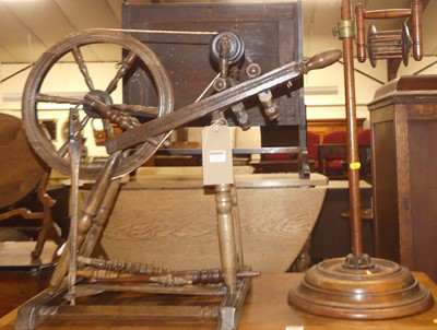 Lot 1222 - A provincial fruitwood and elm spinning wheel,...